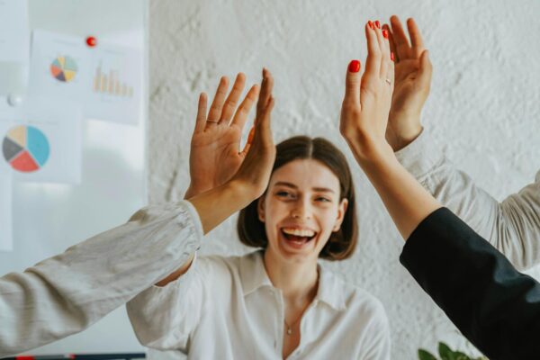 A Group of People Doing a High Five